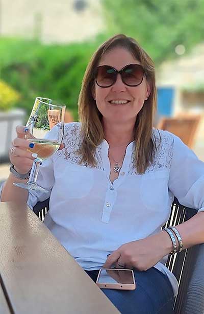 Penny Partlow raising a glass